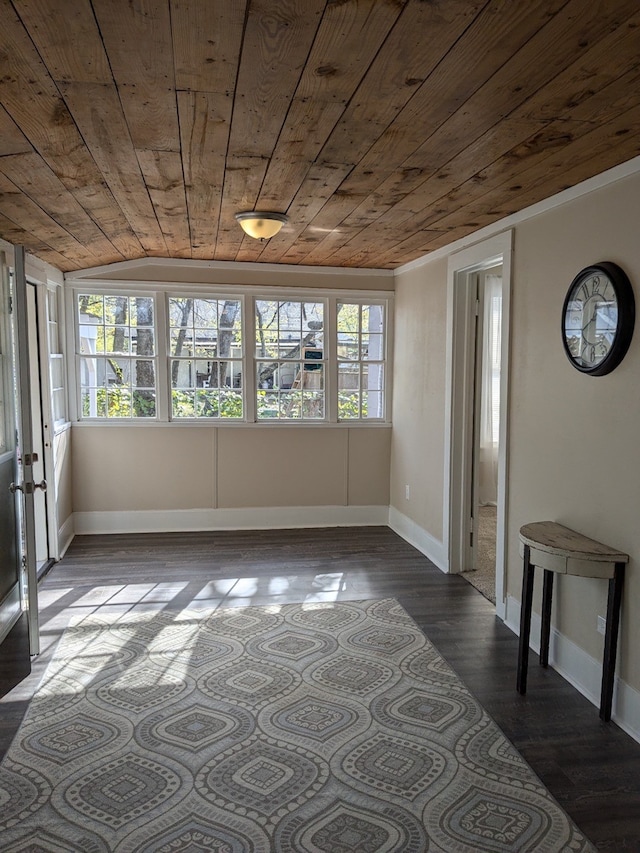 interior space featuring dark hardwood / wood-style floors, lofted ceiling, and wood ceiling