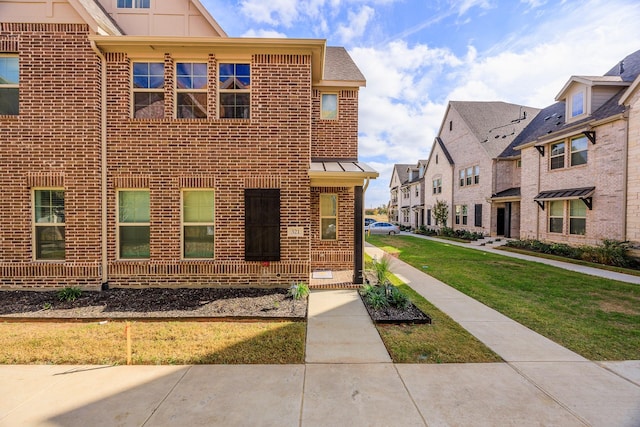 321 Baker Dr, Plano, TX 75074 - view of front facade with brick siding, a residential view, and a front lawn