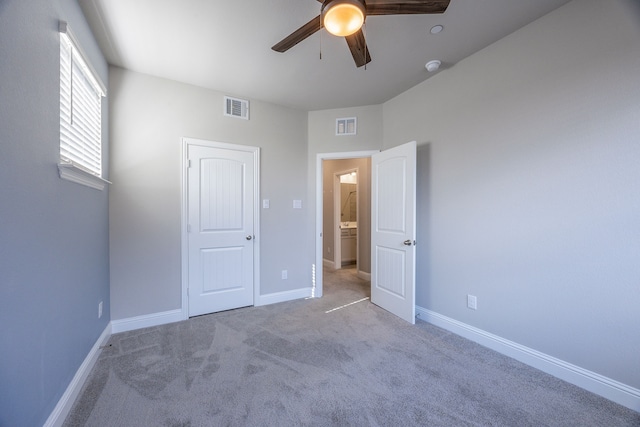 unfurnished bedroom featuring carpet floors and ceiling fan