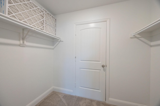 321 Baker Dr, Plano, TX 75074 - walk in closet featuring carpet