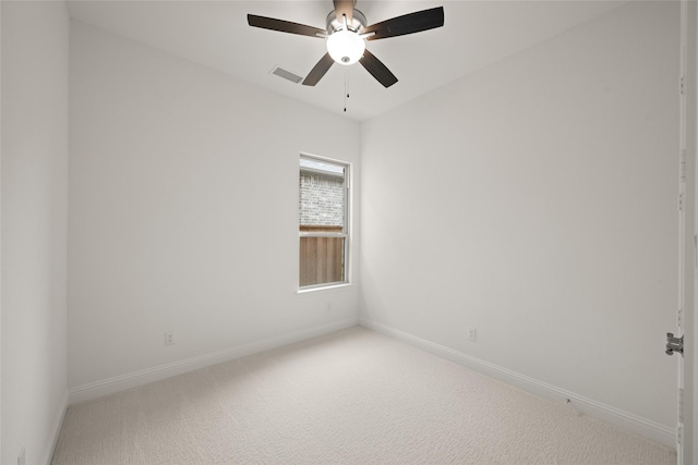 1540 Euclid Aly, Corinth, TX 76208 - spare room with light carpet, baseboards, and ceiling fan