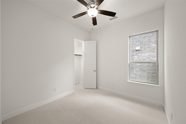 1540 Euclid Aly, Corinth, TX 76208 - unfurnished bedroom with light carpet, a spacious closet, baseboards, and multiple windows