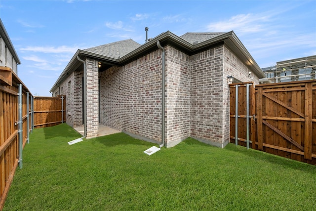 1540 Euclid Aly, Corinth, TX 76208 - rear view of house with brick siding and a gate