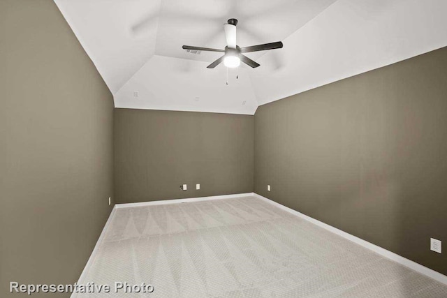 additional living space featuring light carpet, ceiling fan, and lofted ceiling