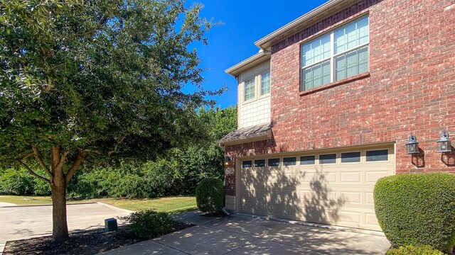 view of property exterior with a garage