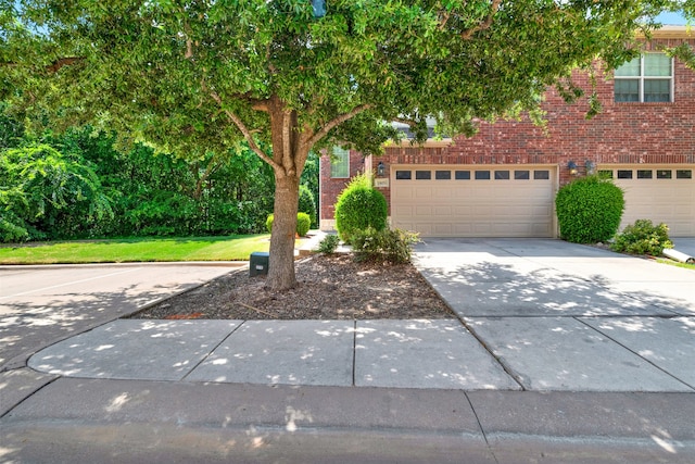 view of front of house featuring a garage and a front yard