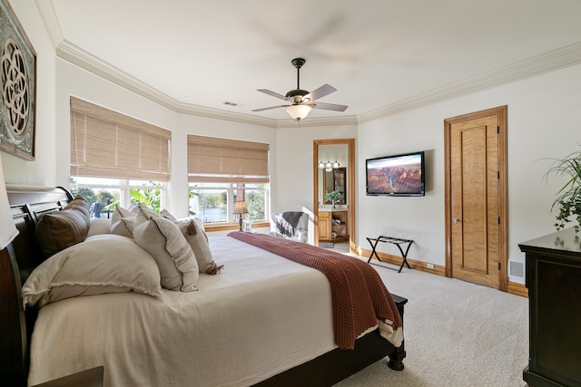 carpeted bedroom featuring ceiling fan and crown molding