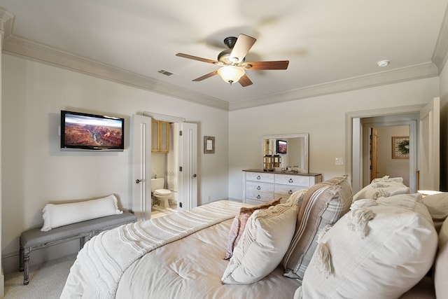 bedroom featuring ensuite bath, ceiling fan, crown molding, and light carpet