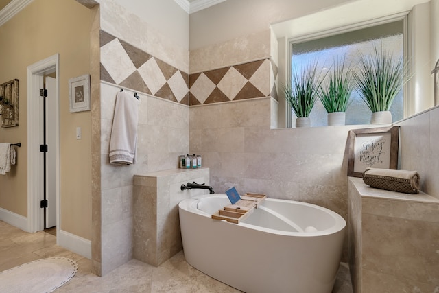 bathroom featuring a washtub, tile walls, and ornamental molding