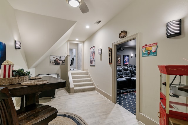 hallway with light hardwood / wood-style floors