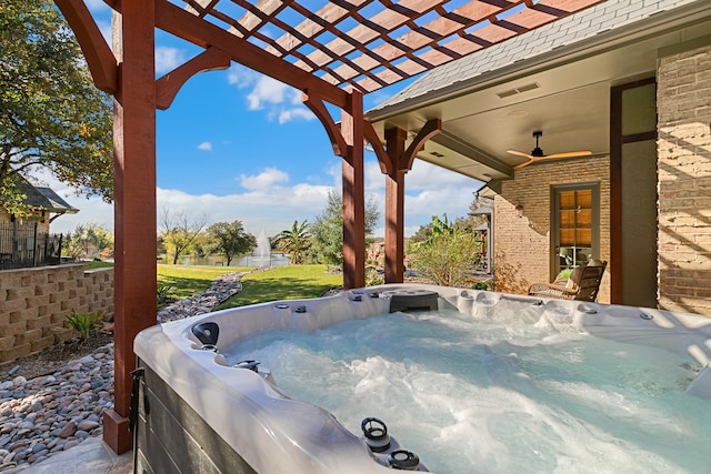 view of patio / terrace featuring a pergola, a hot tub, and ceiling fan