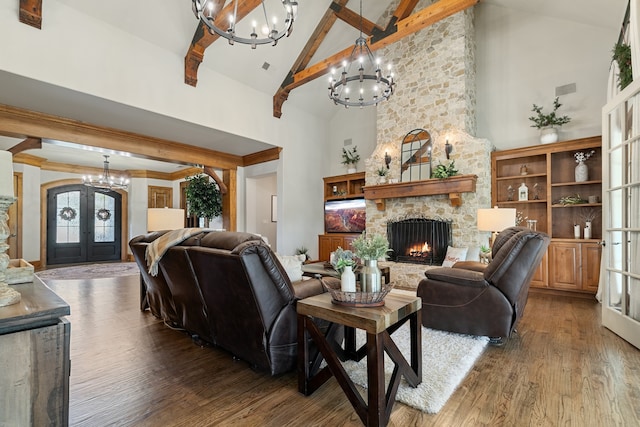 living room with a wealth of natural light, french doors, high vaulted ceiling, and wood-type flooring