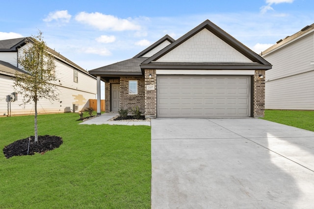 view of front of property featuring a garage and a front yard