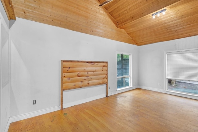 unfurnished living room featuring hardwood / wood-style floors, beamed ceiling, wood ceiling, and high vaulted ceiling