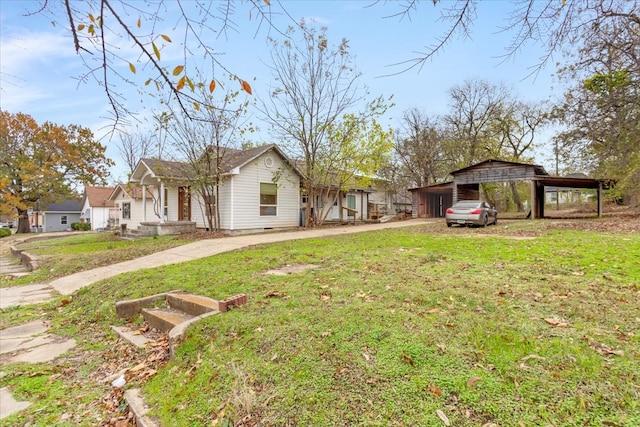 exterior space with a front lawn and a carport