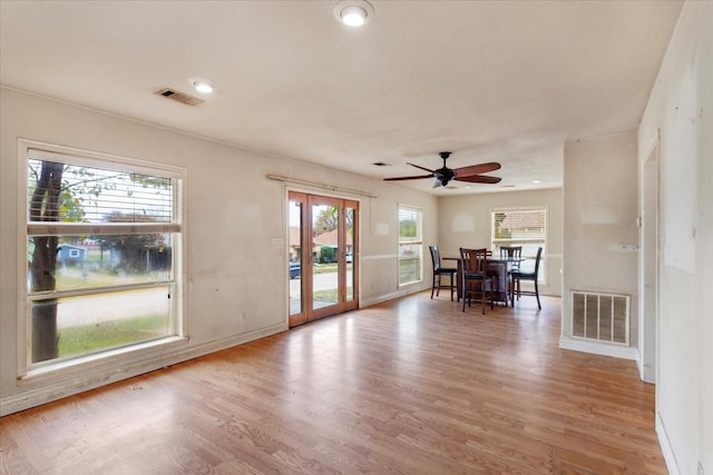 unfurnished dining area featuring plenty of natural light and light hardwood / wood-style flooring