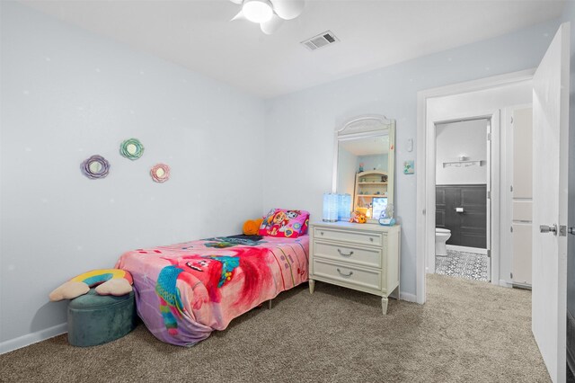 carpeted bedroom with ceiling fan and ensuite bathroom