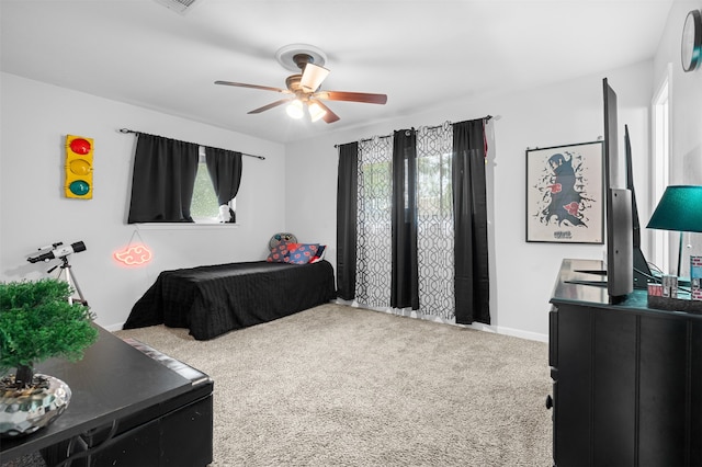 bedroom with carpet, multiple windows, and ceiling fan