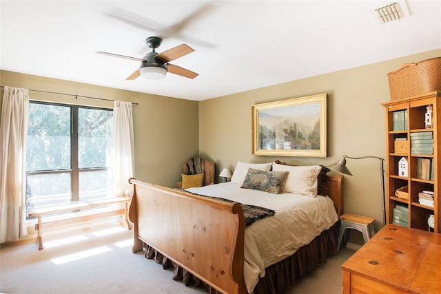 bedroom featuring ceiling fan and light carpet