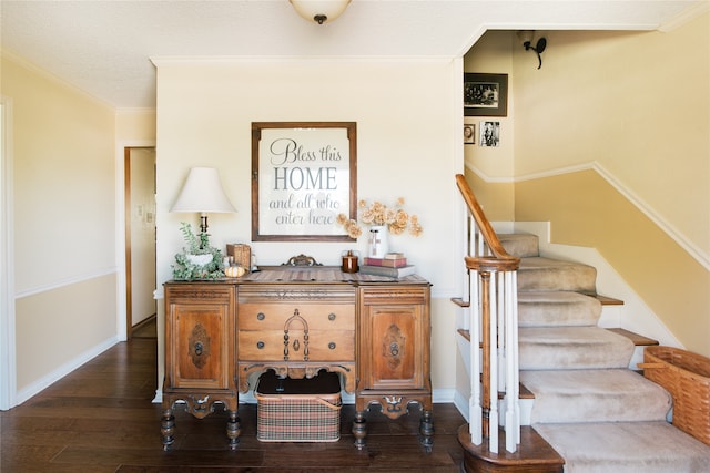 stairs featuring hardwood / wood-style flooring, crown molding, and a textured ceiling