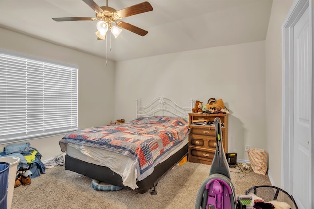 carpeted bedroom featuring ceiling fan