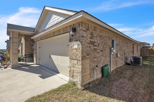 view of property exterior featuring cooling unit and a garage