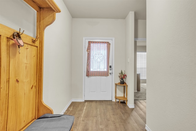 entryway with light hardwood / wood-style floors