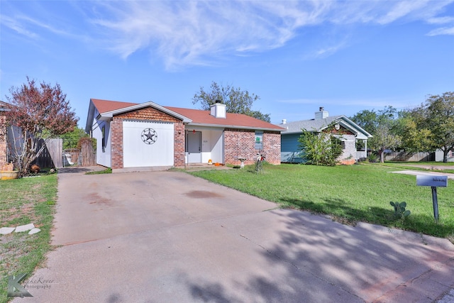 view of front facade with a front yard and a garage