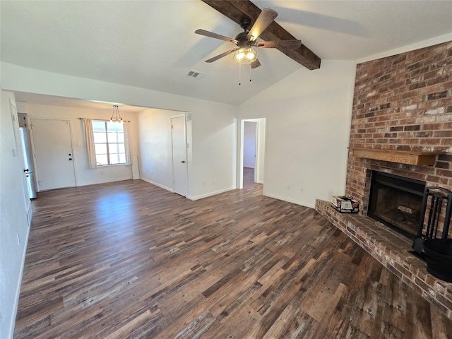 unfurnished living room with a fireplace, ceiling fan, lofted ceiling with beams, and dark hardwood / wood-style floors