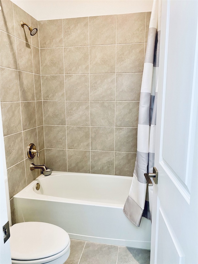 bathroom with tile patterned flooring, shower / bathtub combination with curtain, and toilet