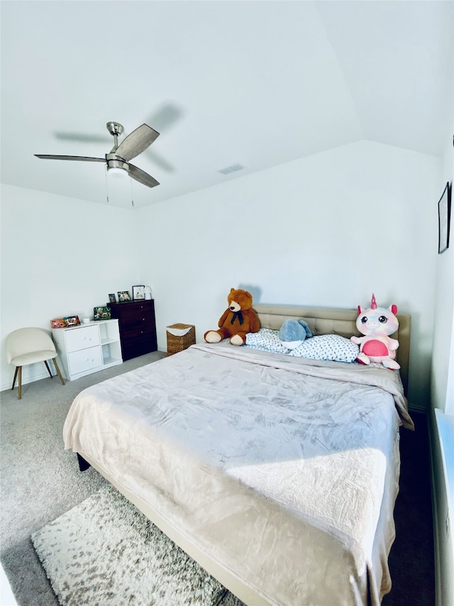 bedroom with ceiling fan, carpet floors, and lofted ceiling