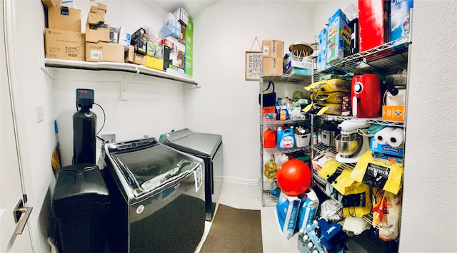 clothes washing area featuring washer and dryer