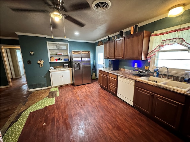 kitchen featuring stainless steel fridge with ice dispenser, white dishwasher, a wealth of natural light, and sink