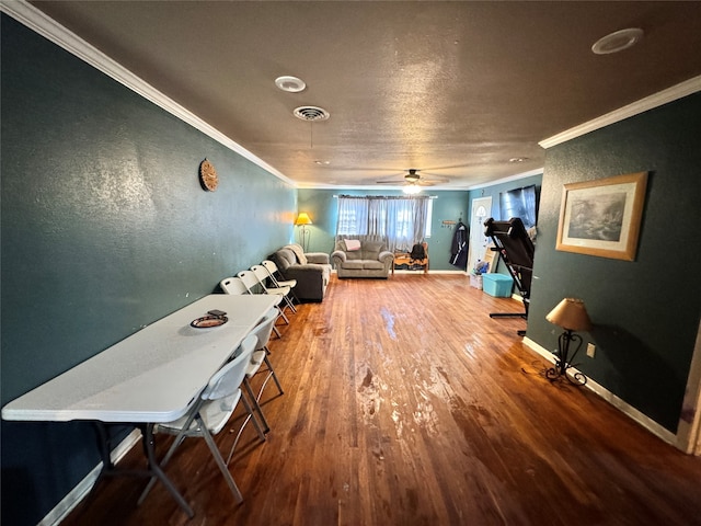 interior space with crown molding, ceiling fan, and wood-type flooring