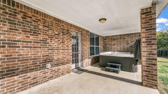 view of patio / terrace featuring a hot tub