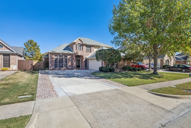 view of front of home featuring a garage and a front yard