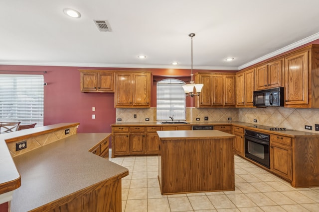 kitchen with sink, black appliances, light tile patterned floors, decorative light fixtures, and a center island