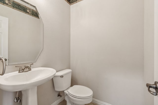 bathroom featuring sink and toilet