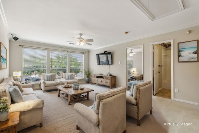 carpeted living room with ceiling fan and ornamental molding