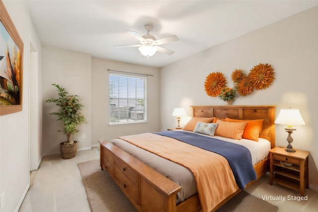 bedroom with light carpet and ceiling fan