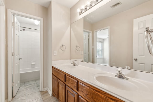 bathroom featuring vanity and shower / washtub combination