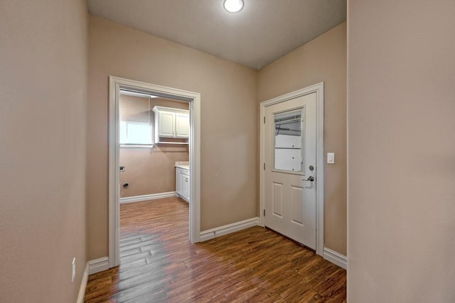 doorway with hardwood / wood-style flooring