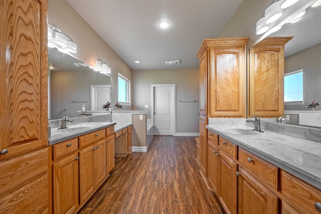 bathroom featuring vanity and hardwood / wood-style flooring