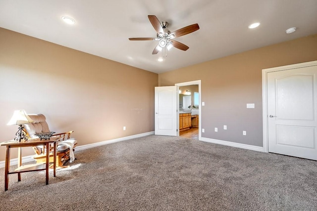 unfurnished bedroom with ensuite bathroom and carpet floors