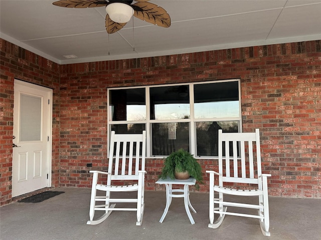 view of patio featuring ceiling fan