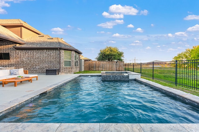 view of pool featuring a patio area and an in ground hot tub