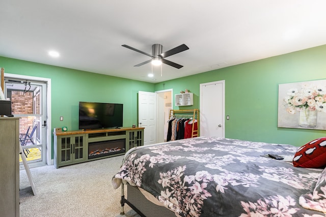 bedroom featuring ceiling fan, a closet, and carpet floors