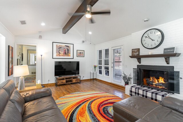 living room with vaulted ceiling with beams, hardwood / wood-style flooring, decorative columns, and ceiling fan