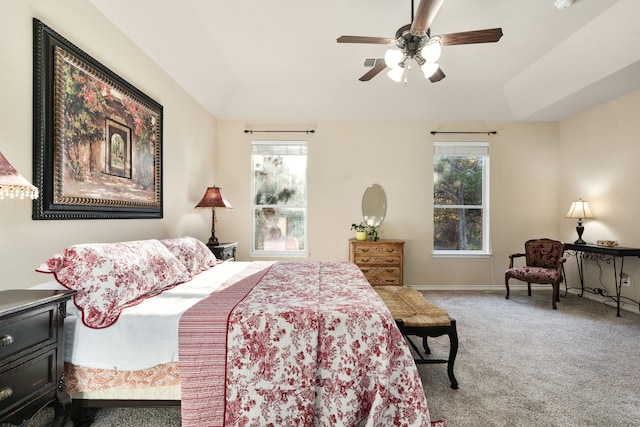 bedroom with ceiling fan, carpet, and multiple windows