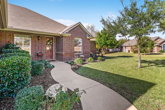 ranch-style house featuring a yard